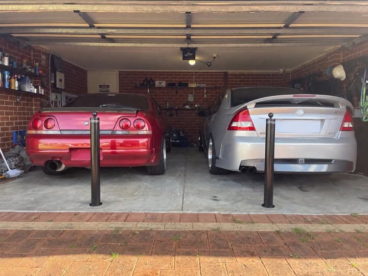 90mm removable bollards protecting vehicles in a double garage