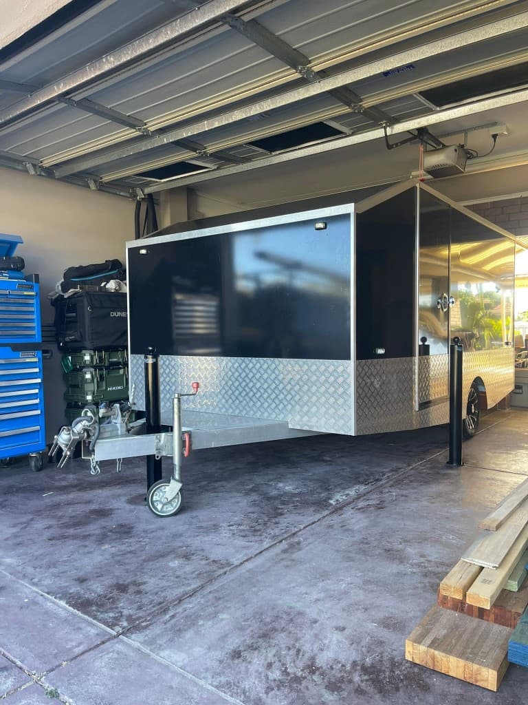 90mm removable bollards protecting a trailer in a garage